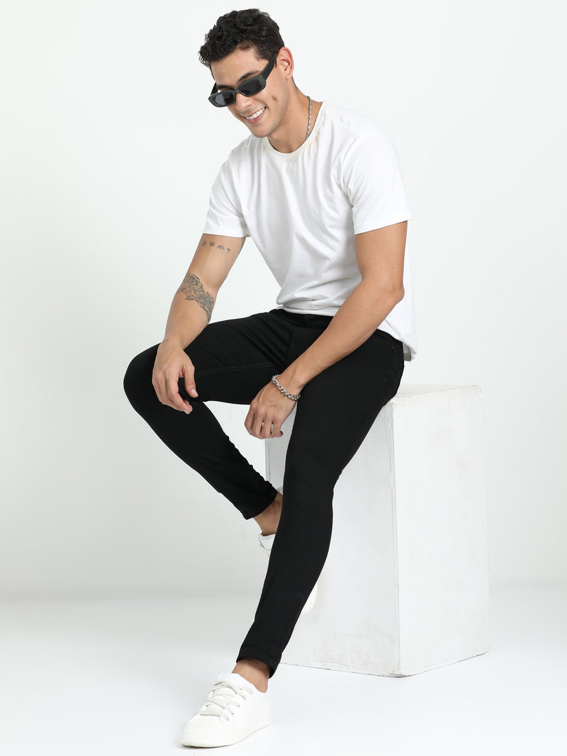 Shop Men's Black Relaxed Denim Ankle fit Cotton Blend Jeans Online.