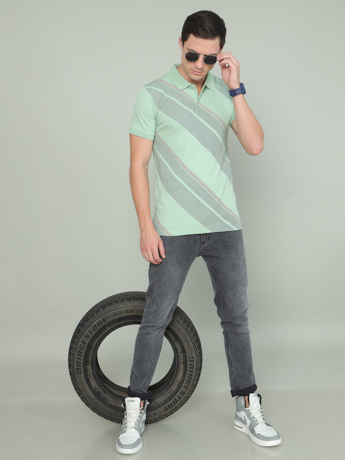 Shop Men's Green Printed Regular Fit Half Sleeves Polo Neck T-Shirt Online.