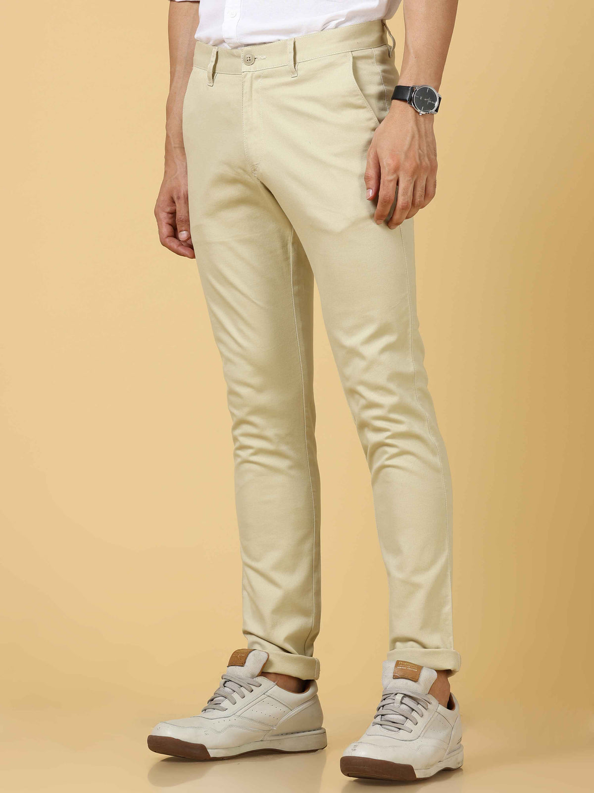 Shop Men's Cream Narrow Fit Solid Casual Trouser Online.